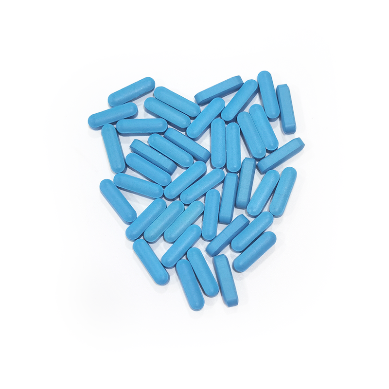 Blue oval male sex enhancement tablets arranged into heart shape for custom wholesale